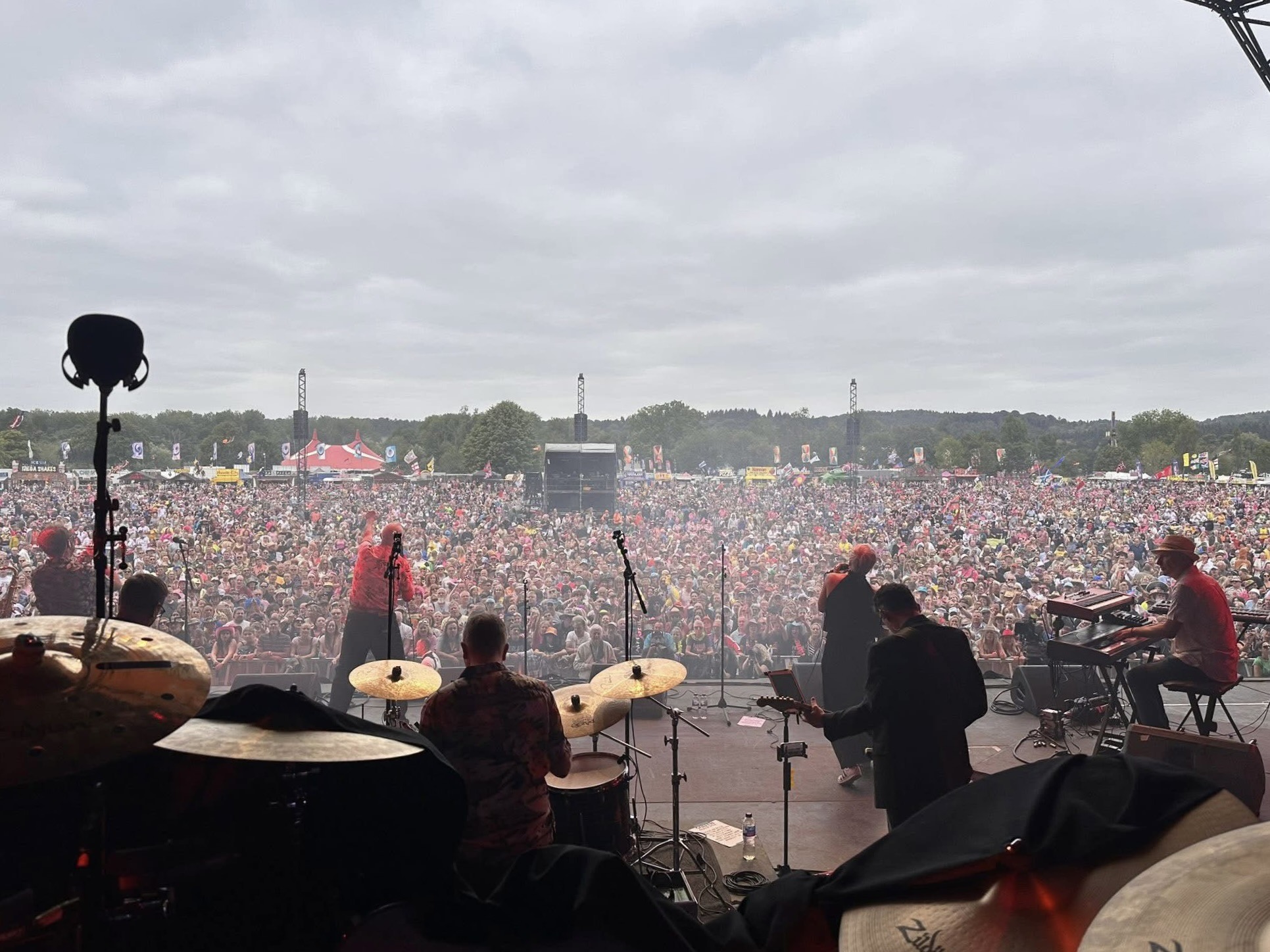 View from the stage across an enormous outdoor festival crowd